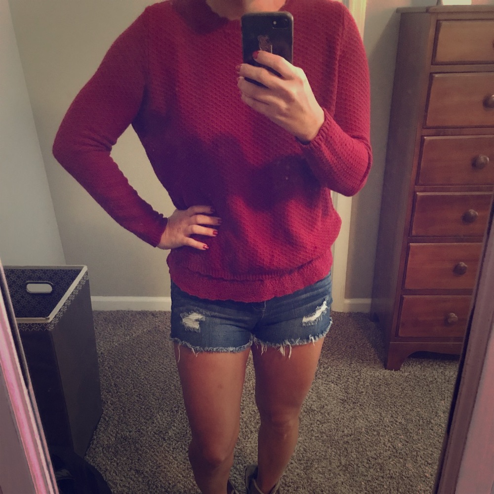 Red sweater with lace detail and open back